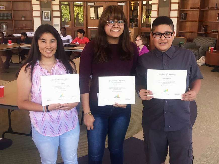 Students with award certificates